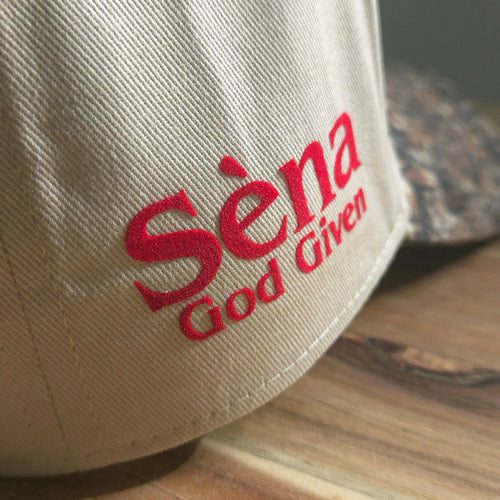 Beige cap with red text on a wooden surface